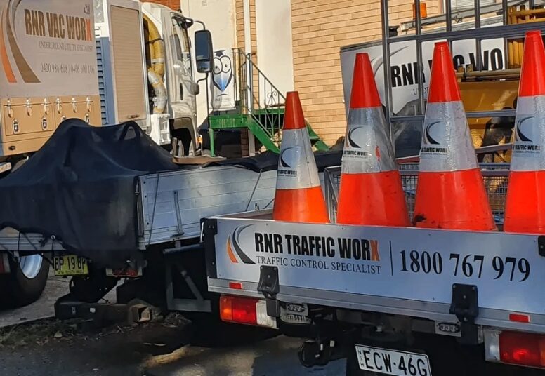 Traffic control trucks with orange cones.